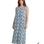 Model wearing a sleeveless, ankle-length floral maxi dress in blue, green, and white on a white studio background with Lydia Creations logo nearby.