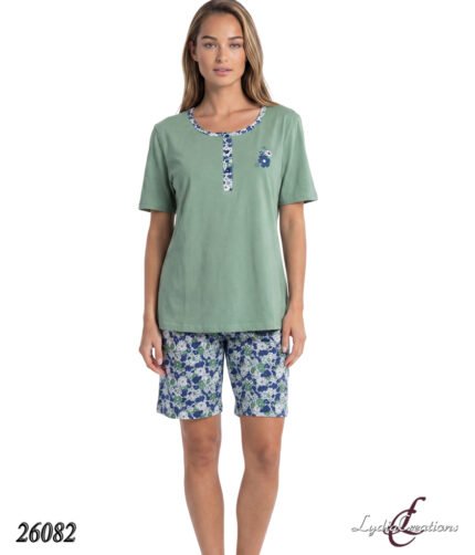 Model wearing a sage-green short-sleeve top with blue floral trim and matching blue floral shorts (product 26082).