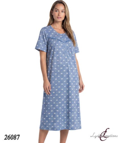 Woman wearing a blue midi-length nightdress with small white floral print, standing against a white background; product 26087 by Lydia Creations.