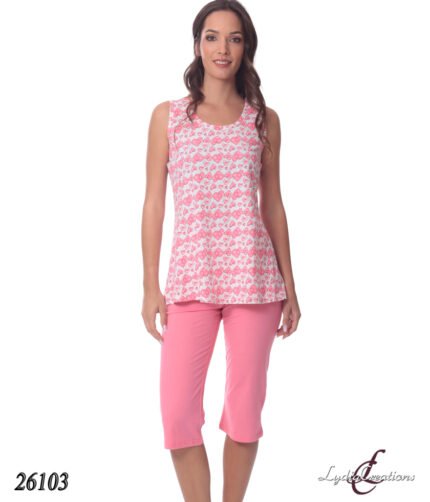 Model wearing a white sleeveless top with a pink heart pattern and pink knee-length capri pants, studio shot