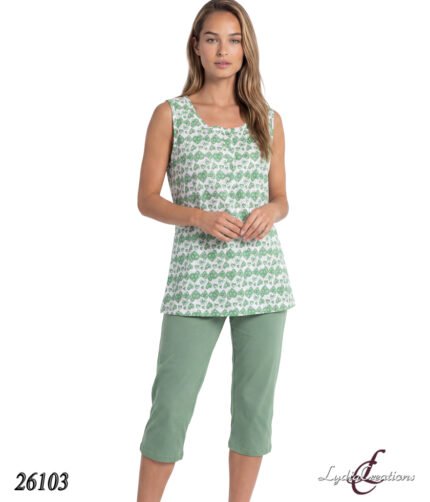 Model wearing a sleeveless green leaf-pattern tunic and sage capri pants; studio product shot, front view