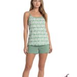 Model in a green heart-pattern tank top with thin straps and matching green shorts, product photo.