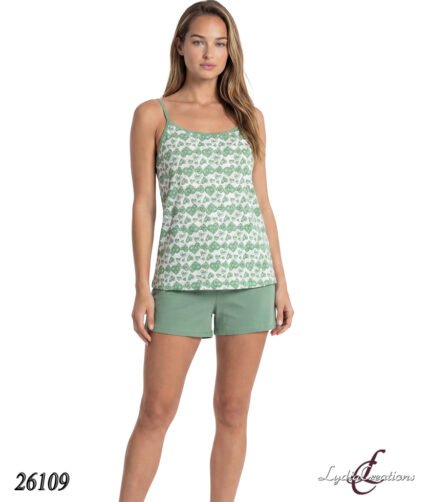 Model in a green heart-pattern tank top with thin straps and matching green shorts, product photo.