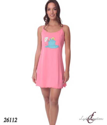 Woman wearing a pink slip dress with a cartoon blue frog graphic on the chest, standing and smiling.